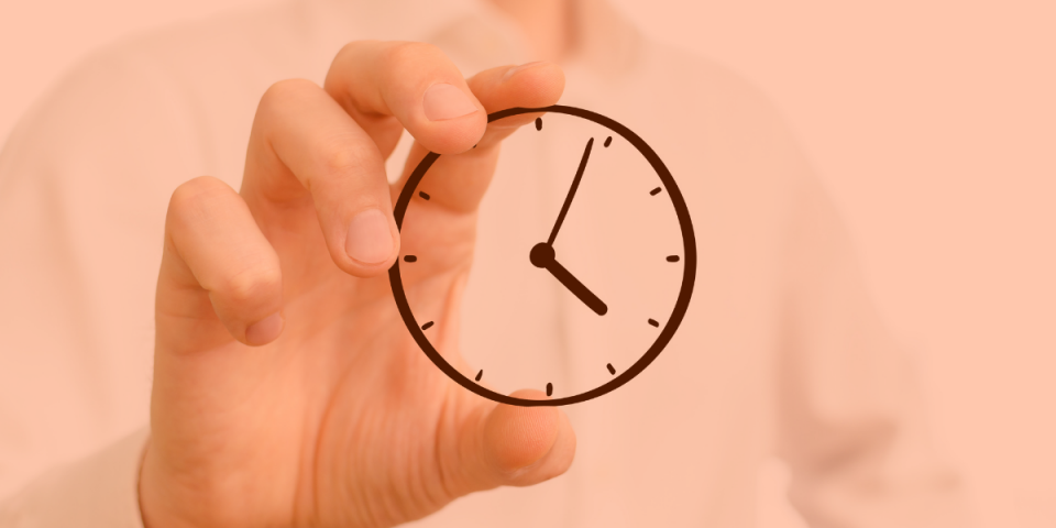 A hand is holding an animated analog clock between its fingers