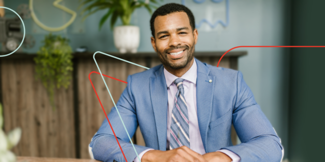 Smiling Black man, bookkeeping virtual assistant, enjoying working from his home office.