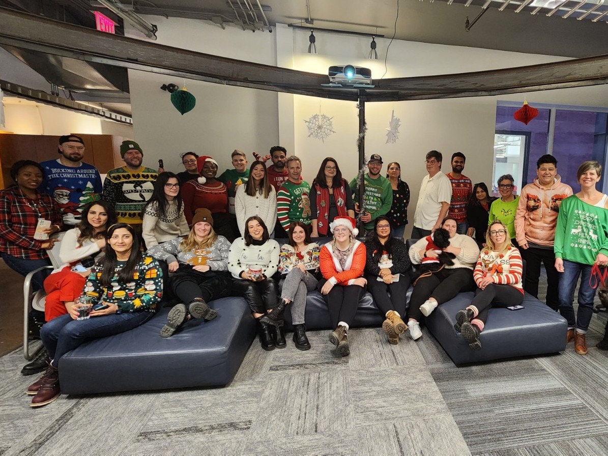 Holiday photo of all of the Virtual Gurus staff, wearing holiday sweaters.