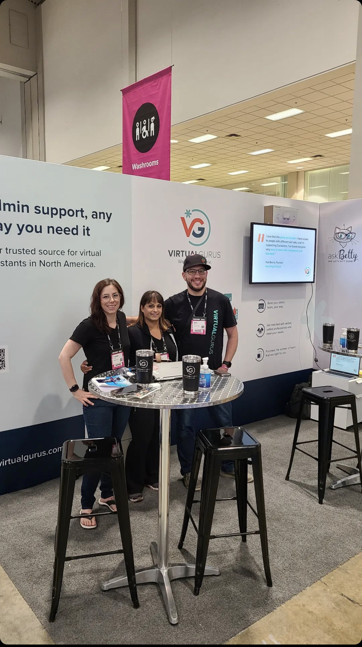 Crystal and two other Virtual Gurus staff members, in a Virtual Gurus and askBetty tradeshow booth.